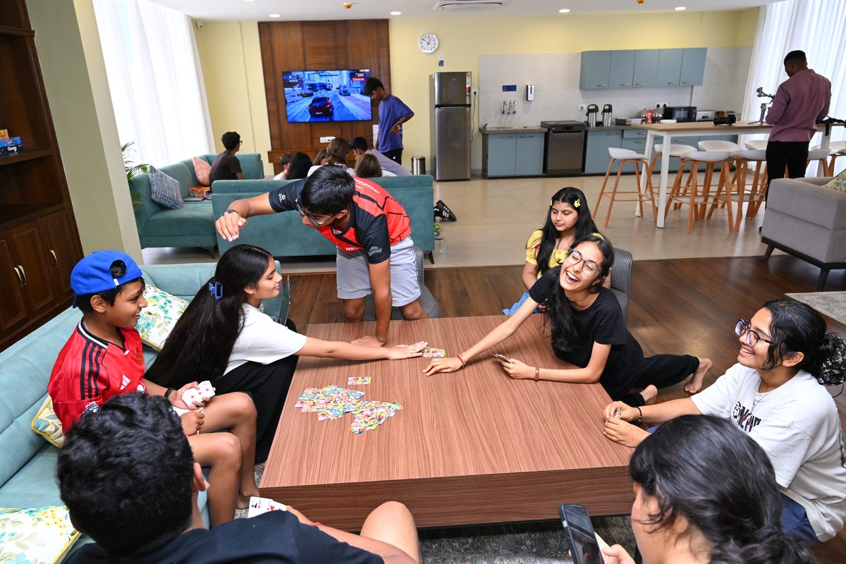 Pupils together in a boarding house common room